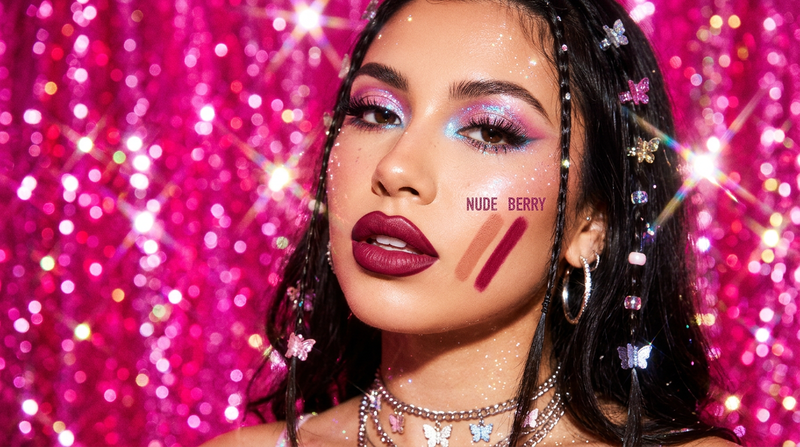 Precise lip liner application with nude and berry swatches on hot pink background