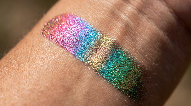 Close-up macro swatch showing prismatic color shift pink blue gold green