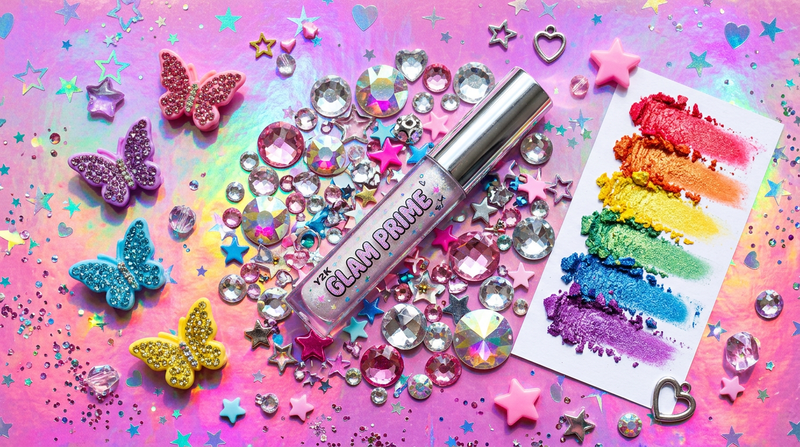 Cybrena Y2K Eye Primer Base - Y2K flatlay with rhinestone gems butterfly clips colorful eyeshadow swatches