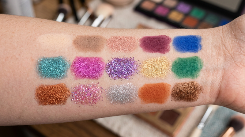 Close-up macro swatches of all 15 eyeshadow pans showing shimmer metallic and glitter finishes