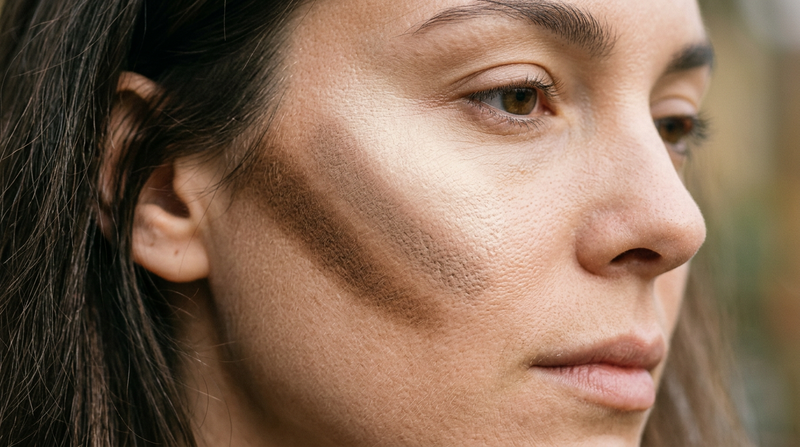 Close-up macro of three contour powder shades applied on skin showing sculpting definition - Cybrena Y2K