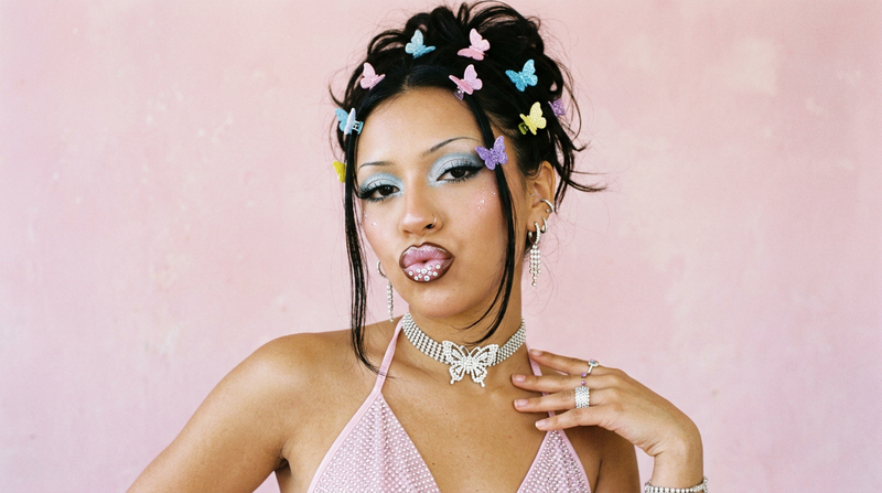 Y2K beauty editorial with bold over-lined lips and butterfly clips