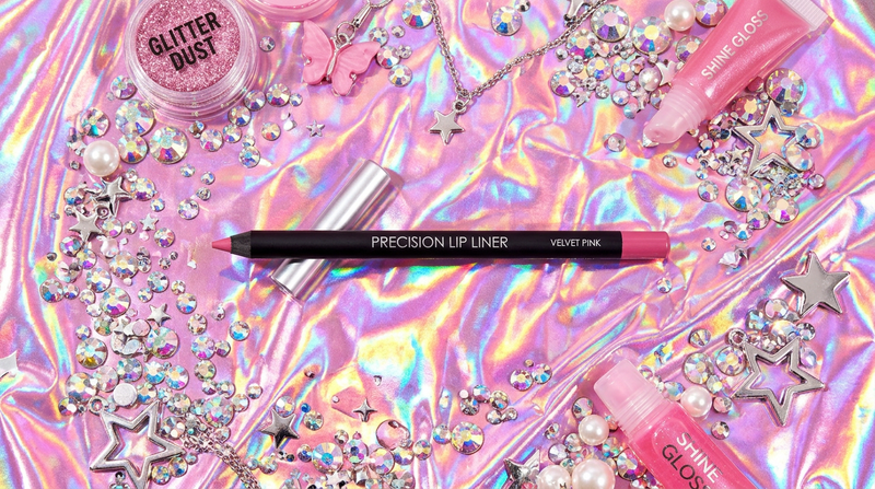 Precision Lip Liner flat lay on holographic pink foil with rhinestones and silver star charms, Y2K maximalist beauty photography