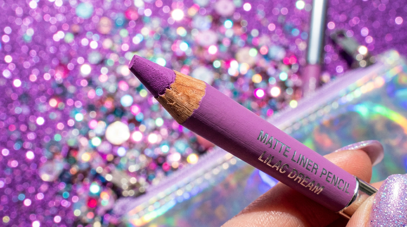 Lip liner pencil tip close-up on electric lilac background - Y2K macro beauty